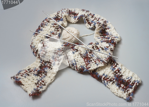 Image of Knitted scarf with knitting needles