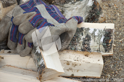 Image of Gloves and  birch firewood