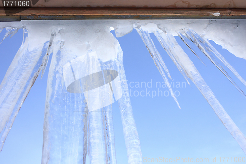 Image of Icicles hang on the eaves