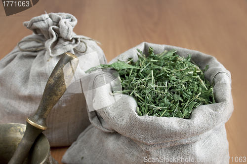 Image of Dried herbs are stored in linen bags
