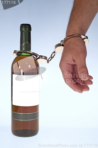 Image of Wine and handcuffs
