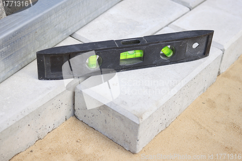 Image of Level gauge it is applied at stone blocks laying