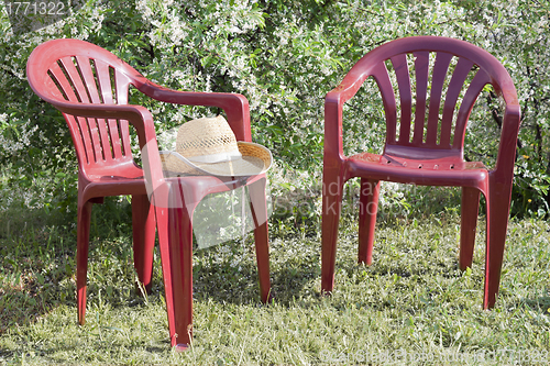 Image of Plastic chairs in the garden