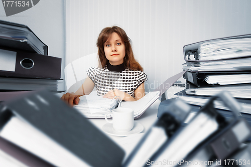 Image of Business woman working in office with documents