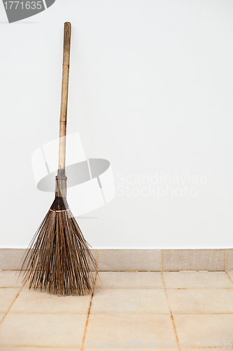 Image of Broom near a white wall