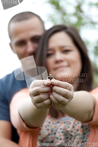 Image of Engaged Couple Holding Ring