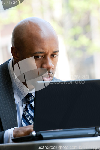 Image of Business Man Using a Laptop