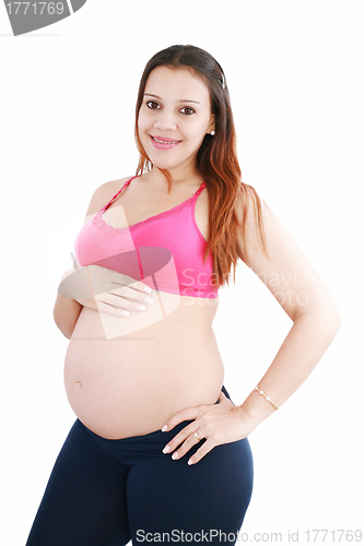 Image of pregnant woman caressing her belly over white background 