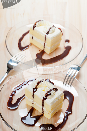 Image of fresh cream cake closeup with chocolate sauce