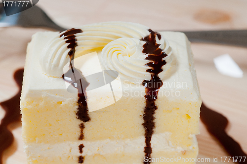 Image of fresh cream cake closeup with chocolate sauce