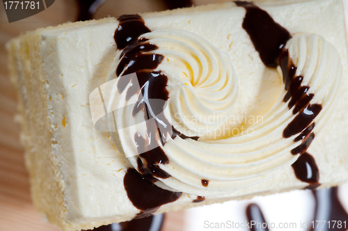 Image of fresh cream cake closeup with chocolate sauce