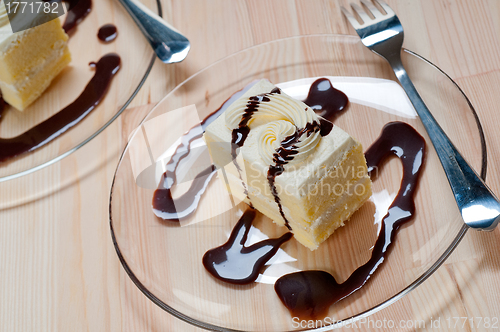 Image of fresh cream cake closeup with chocolate sauce