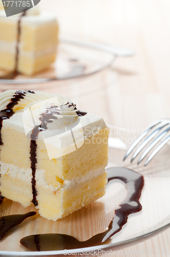 Image of fresh cream cake closeup with chocolate sauce