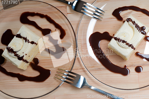 Image of fresh cream cake closeup with chocolate sauce