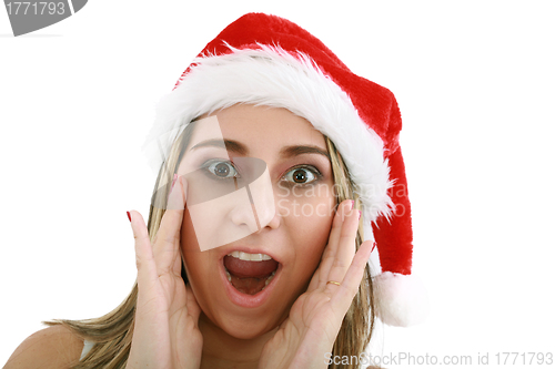 Image of woman in santa hat surprised for Christmas. 