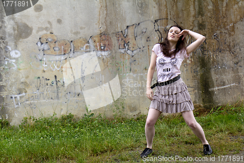 Image of Dancer in front of a wall.