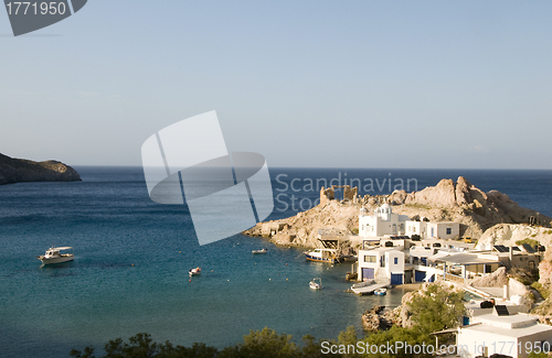 Image of houses built into rock cliffs on Mediterranean Sea Firopotamos M