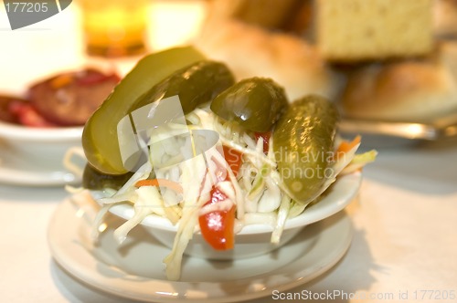 Image of pickles and cole slaw