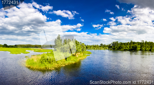 Image of Island with trees on blue cold lake