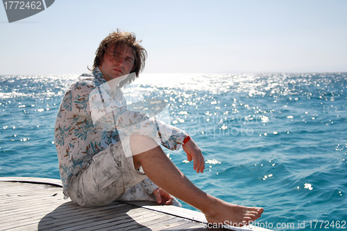 Image of Man posing on the yacht