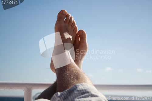 Image of feet high on the yacht