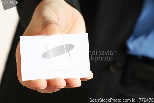 Image of card presented by a business man