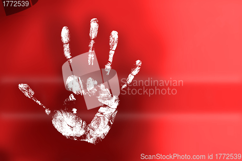 Image of handprint on red background