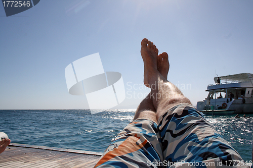 Image of man relaxes on the open sea