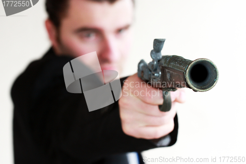 Image of young man with gun