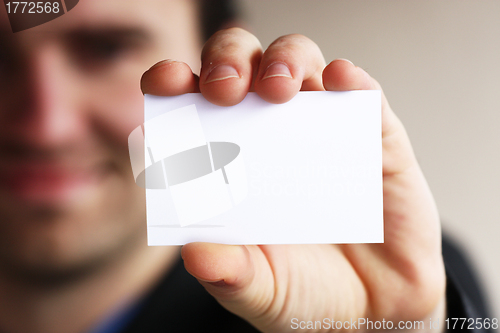 Image of Businessman shows business card