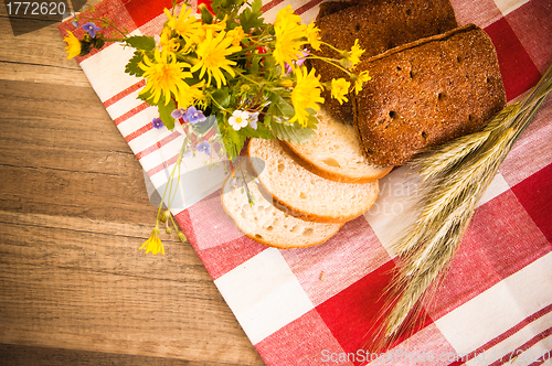 Image of Still life with bread, flowers and spikes 