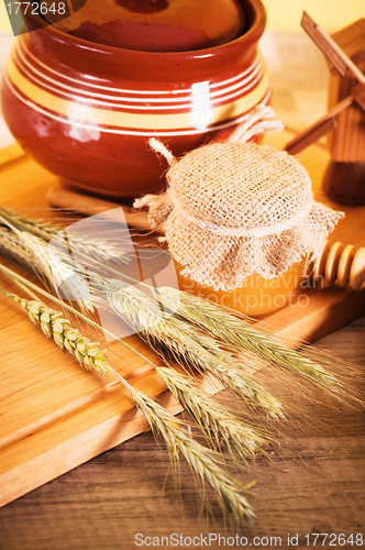Image of sliced bread and wheat on the wooden table 