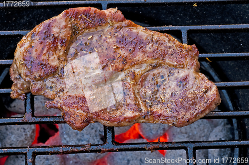 Image of roasted pork neck on barbecue