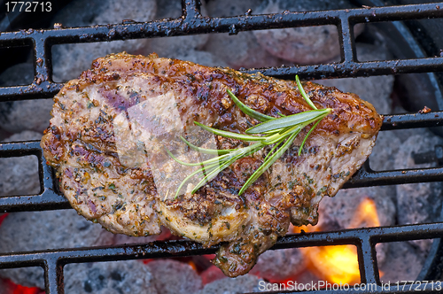 Image of lamb chop neck on barbecue