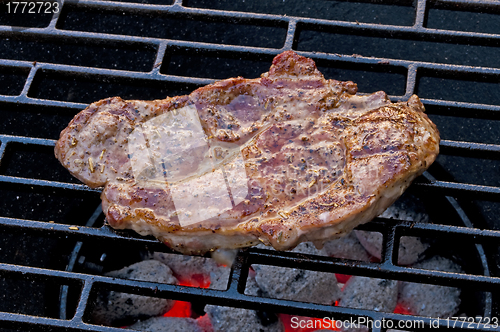 Image of roasted pork neck on barbecue