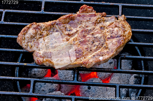 Image of roasted pork neck on barbecue