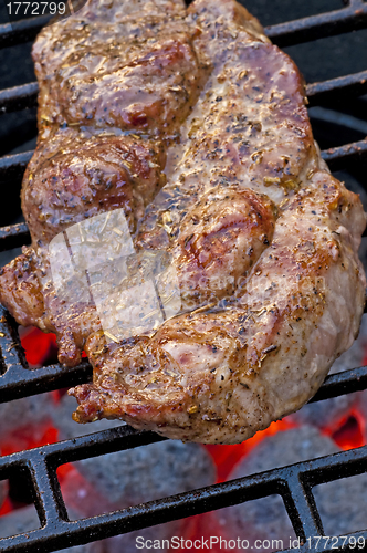 Image of roasted pork neck on barbecue