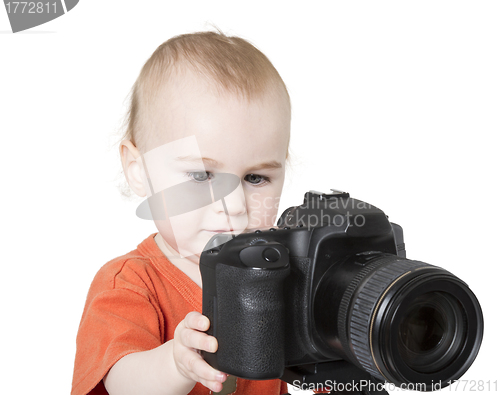 Image of young child with digital camera