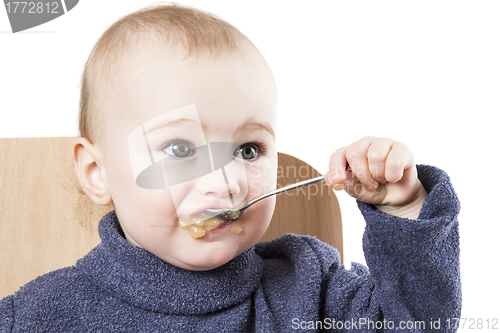 Image of baby eating applesauce