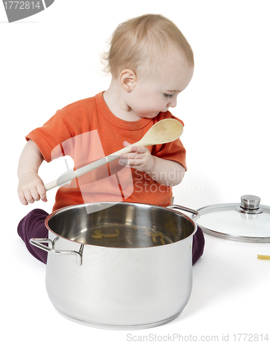 Image of baby with big cooking pot