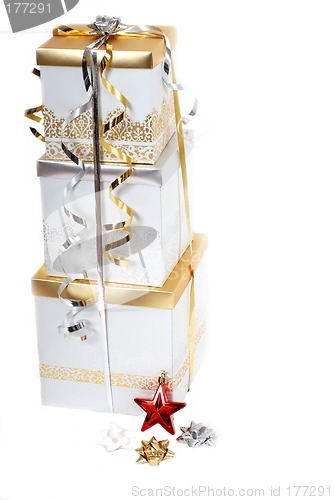 Image of Gold and silver wrapped Christmas gifts