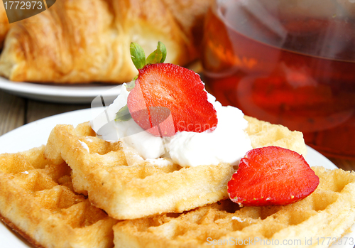 Image of Tasty breakfast - tea, croissants and wafers