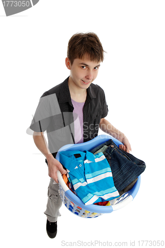 Image of Teenager holding a basket of laundry