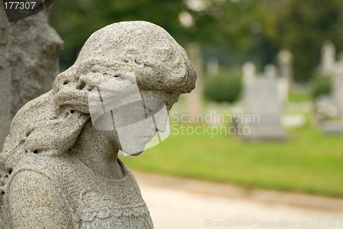 Image of Granite statue of angelic woman at a gravesite