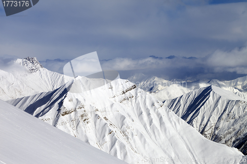Image of Ski slope and snowy mountains