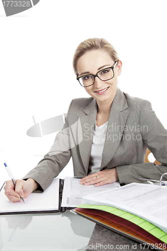 Image of business woman with folders on desk office