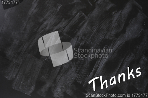 Image of Thanks written on a smudged blackboard background