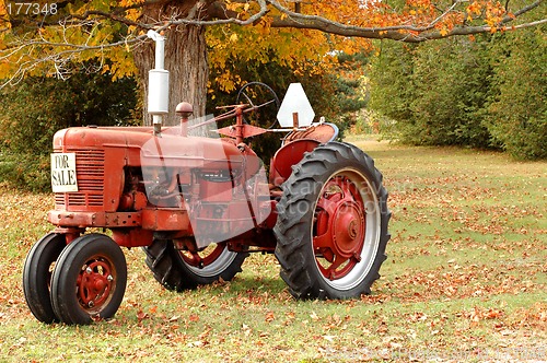 Image of Antique tractor in rural setting