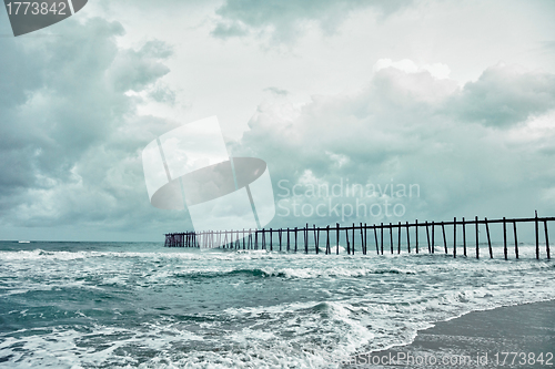 Image of Old jetty over the stormy sea