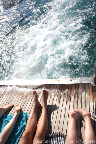 Image of people sunning themselves on deck